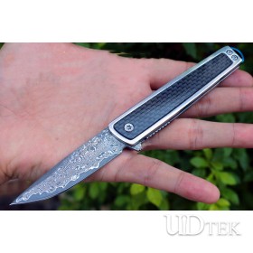 Vietnam war warrior Damascus is quick to open a folding knife UD2105467